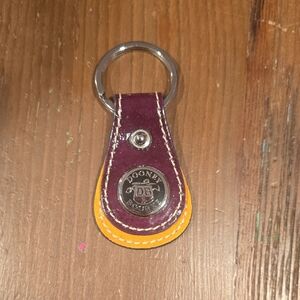 Dooney & Bourke Purple and Yellow Leather Keychain with Logo Medallion